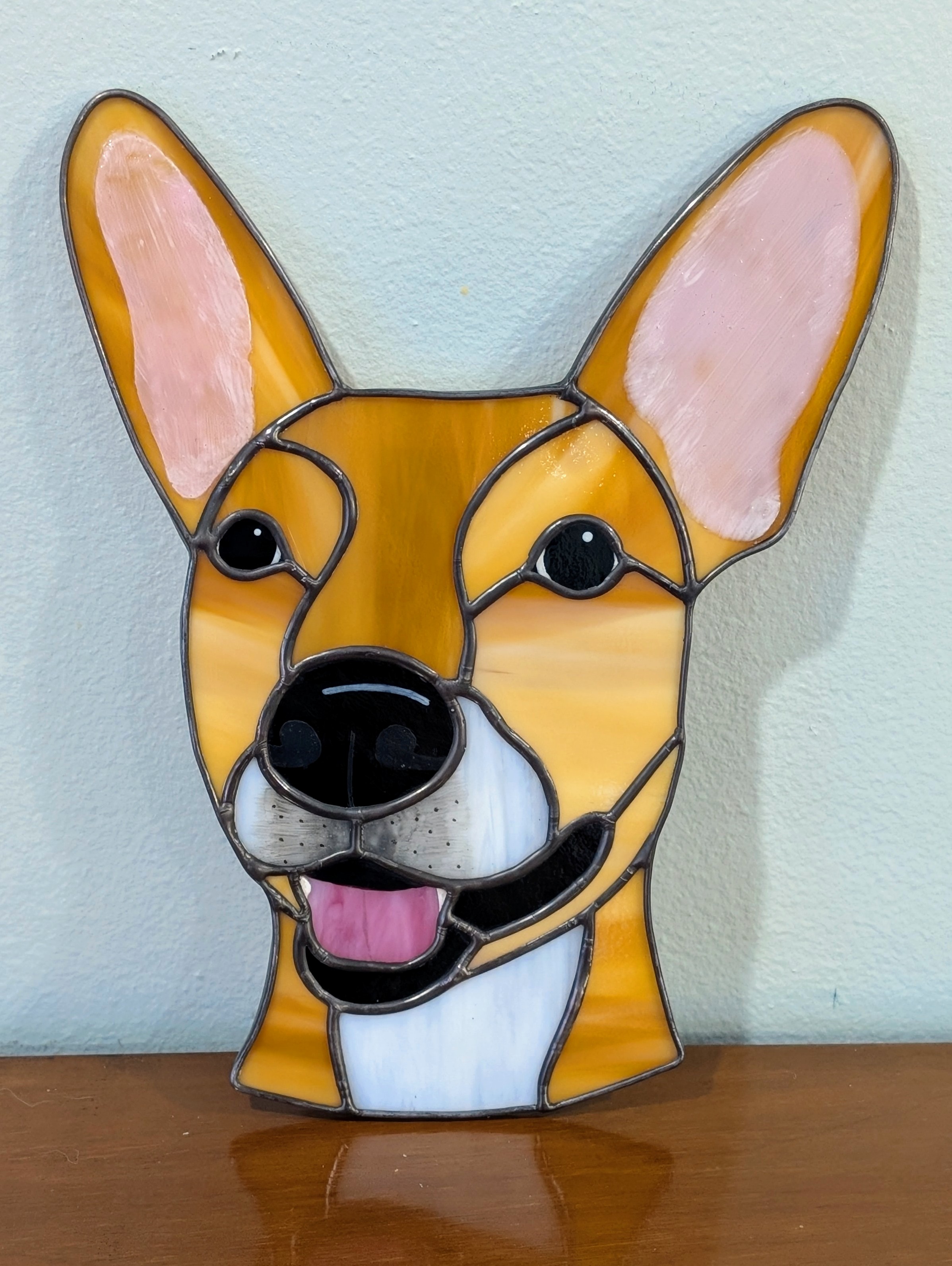 A brown stained glass dog