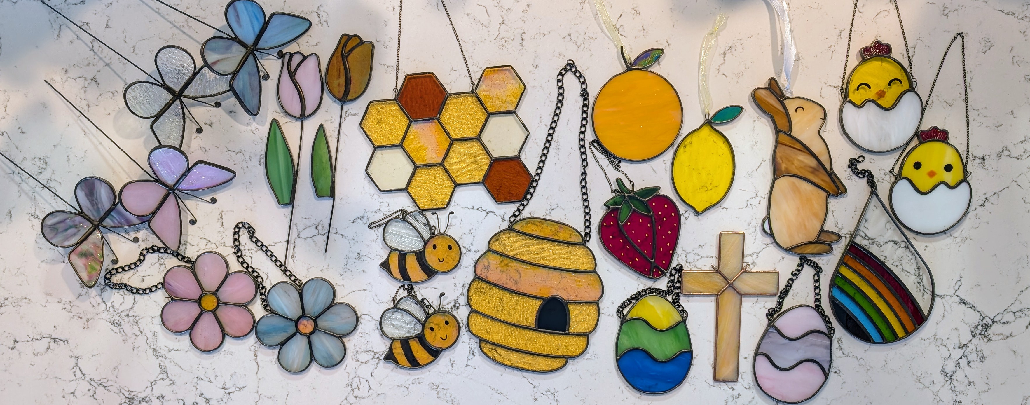 A bunch of different spring themed stained glass designs